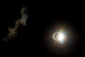 The sun peering out from behind the moon just seconds after totality